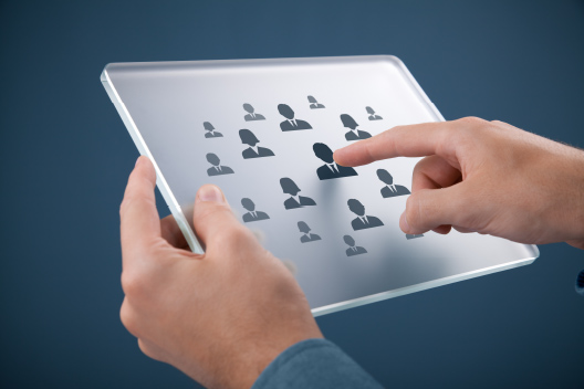 Manager reviewing contractor profiles on a tablet